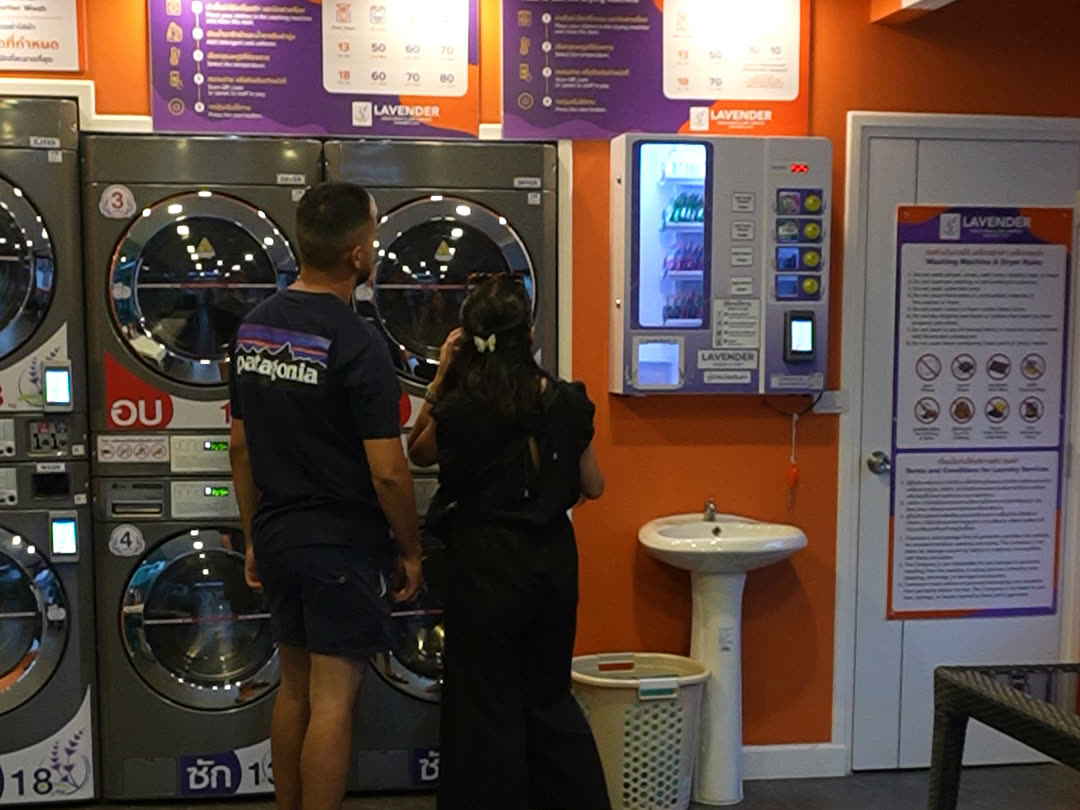 Six stacked commercial washers and dryers
